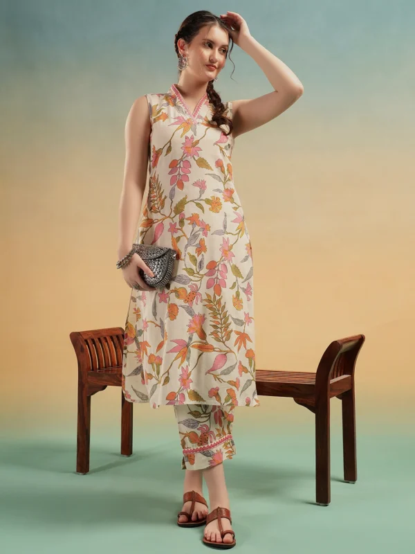 Woman wearing cream floral cotton kurti set with pants for summer
