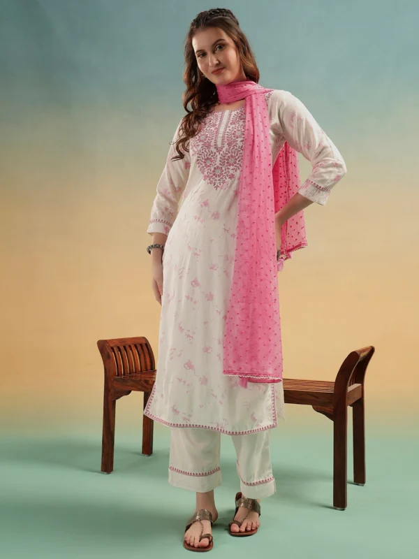 Woman wearing ivory embroidered cotton straight suit set with pink dupatta