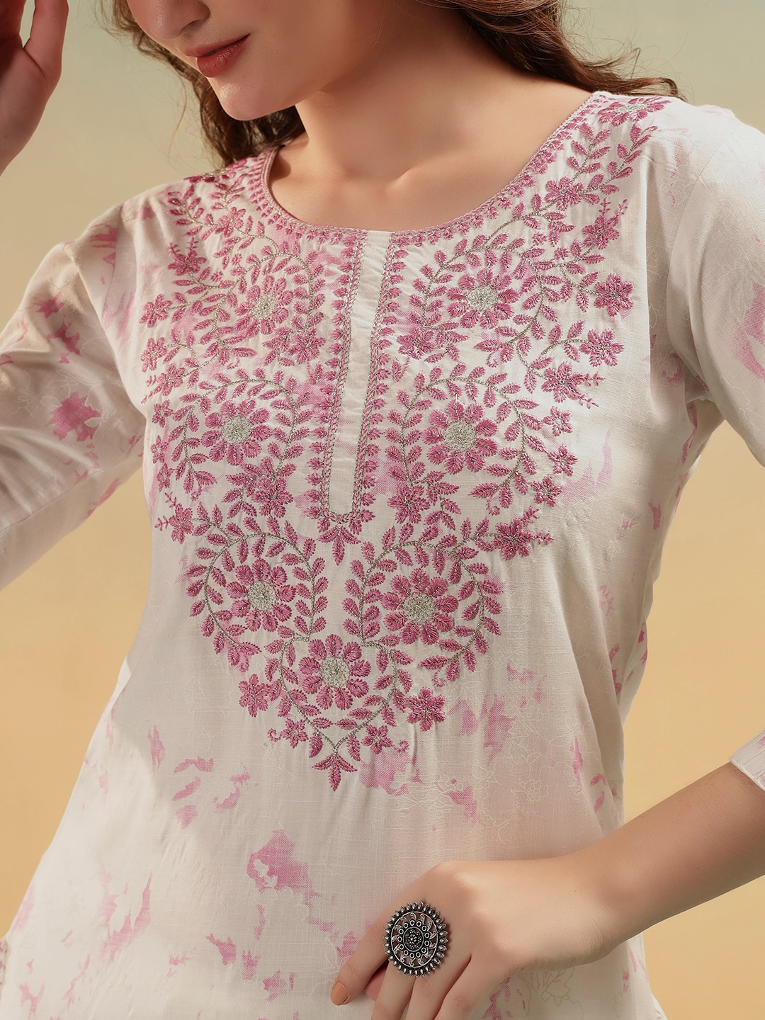 Close-up pink embroidery on ivory cotton straight kurti