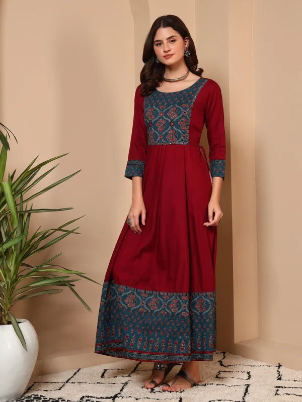 Woman wearing red cotton traditional handwork maxi dress for office and festive wear