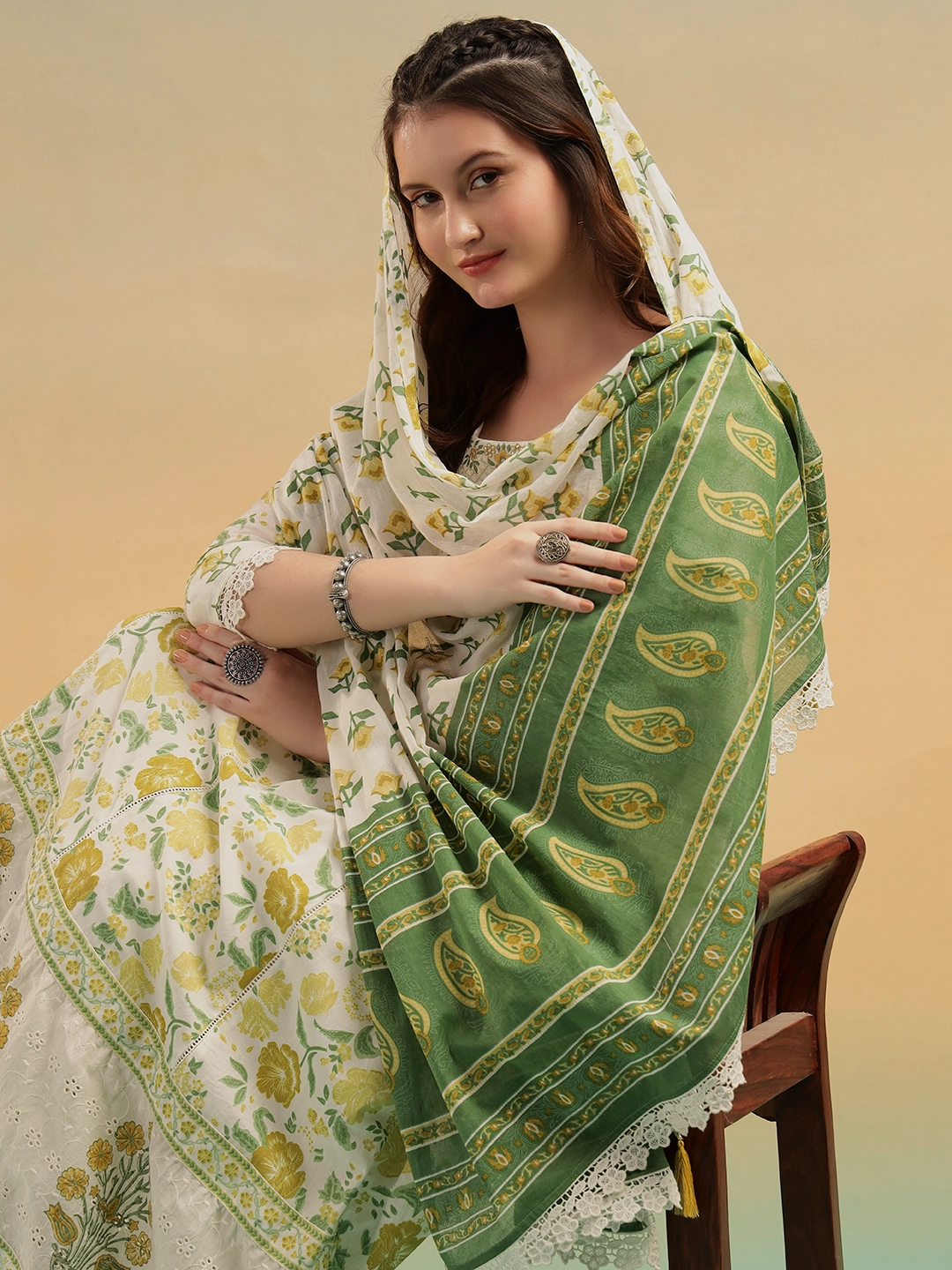 Woman wearing cream Jaipur handblock print cotton A-line suit set with dupatta for summer
