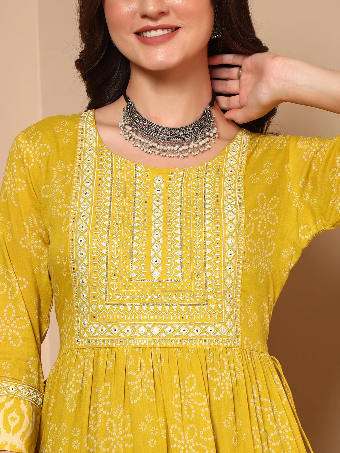 Close up embroidered neckline on yellow cotton mulmul ethnic dress