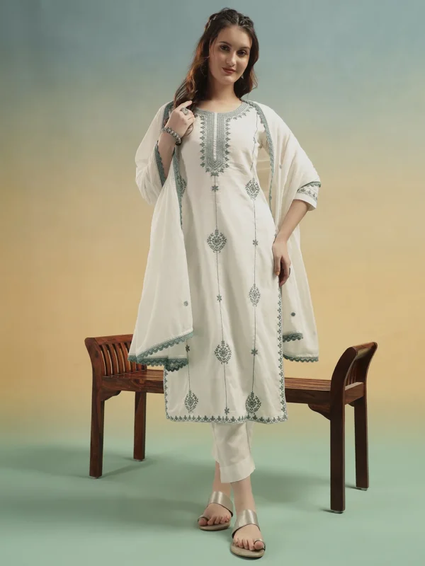 Woman wearing cream embroidered cotton suit set with dupatta